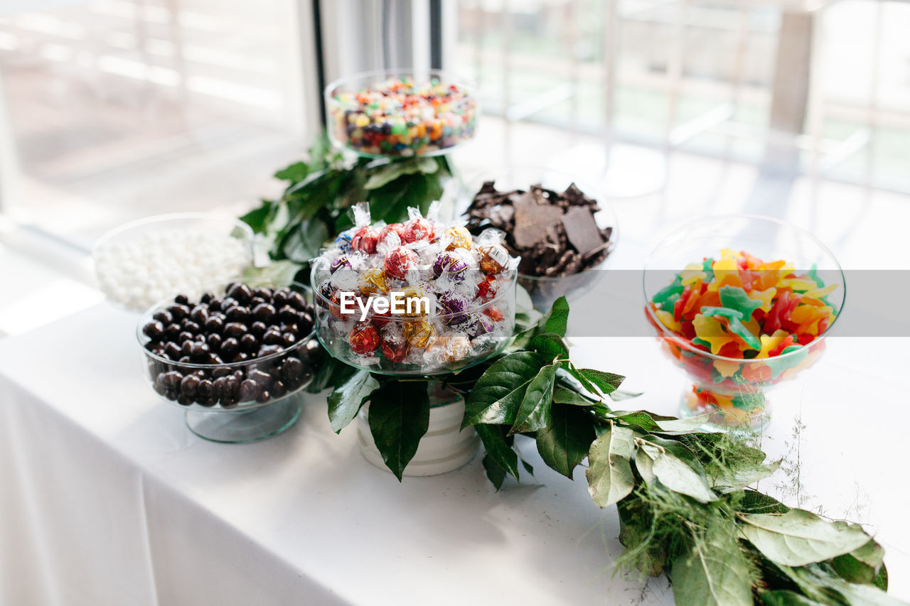 Close-up of sweet food with bouquet on table