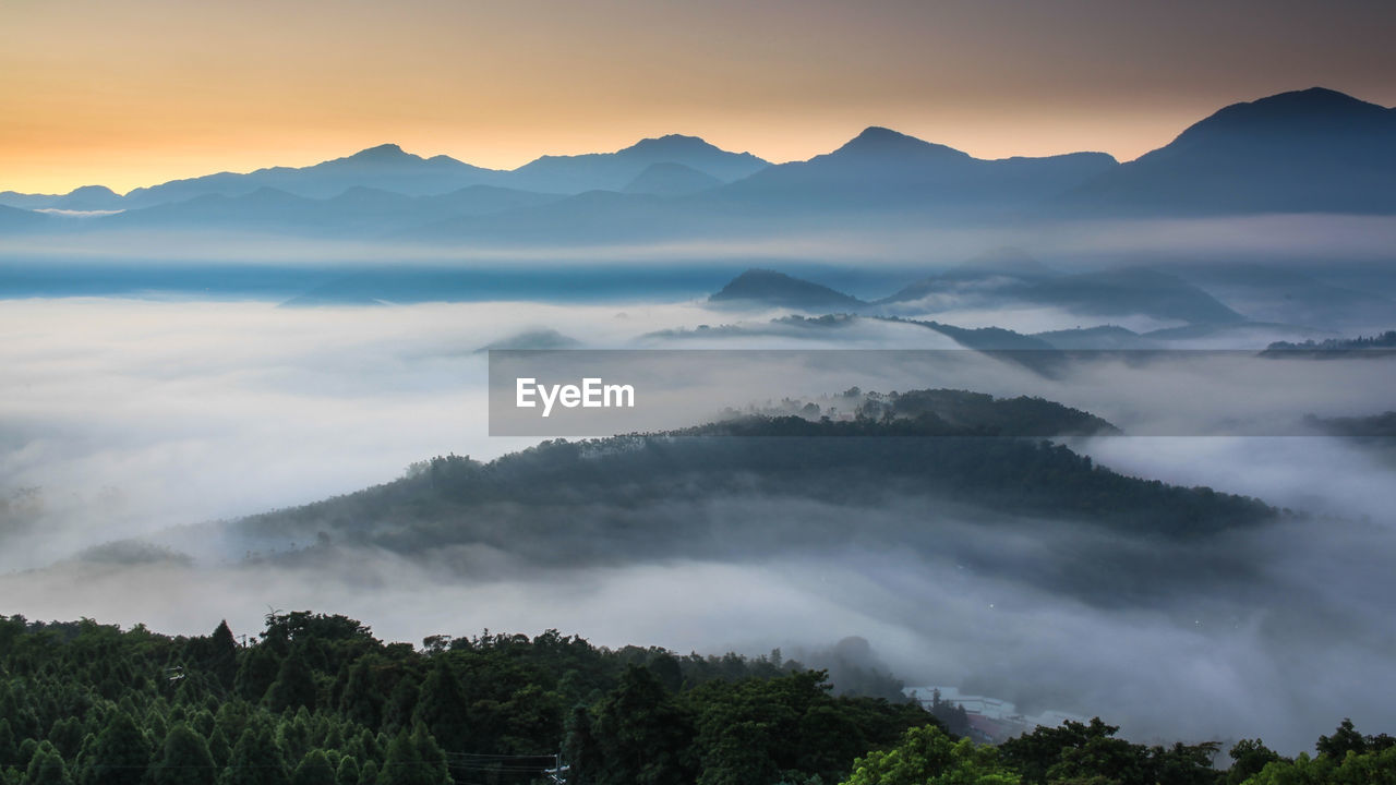 Scenic view of mountains against sky during sunset