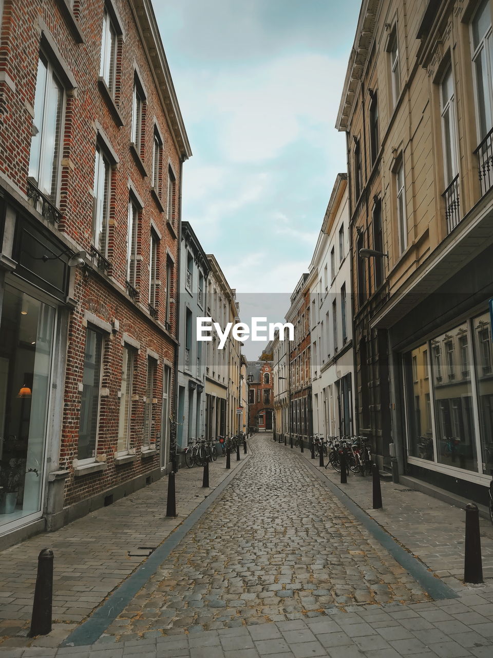 Street amidst buildings against sky