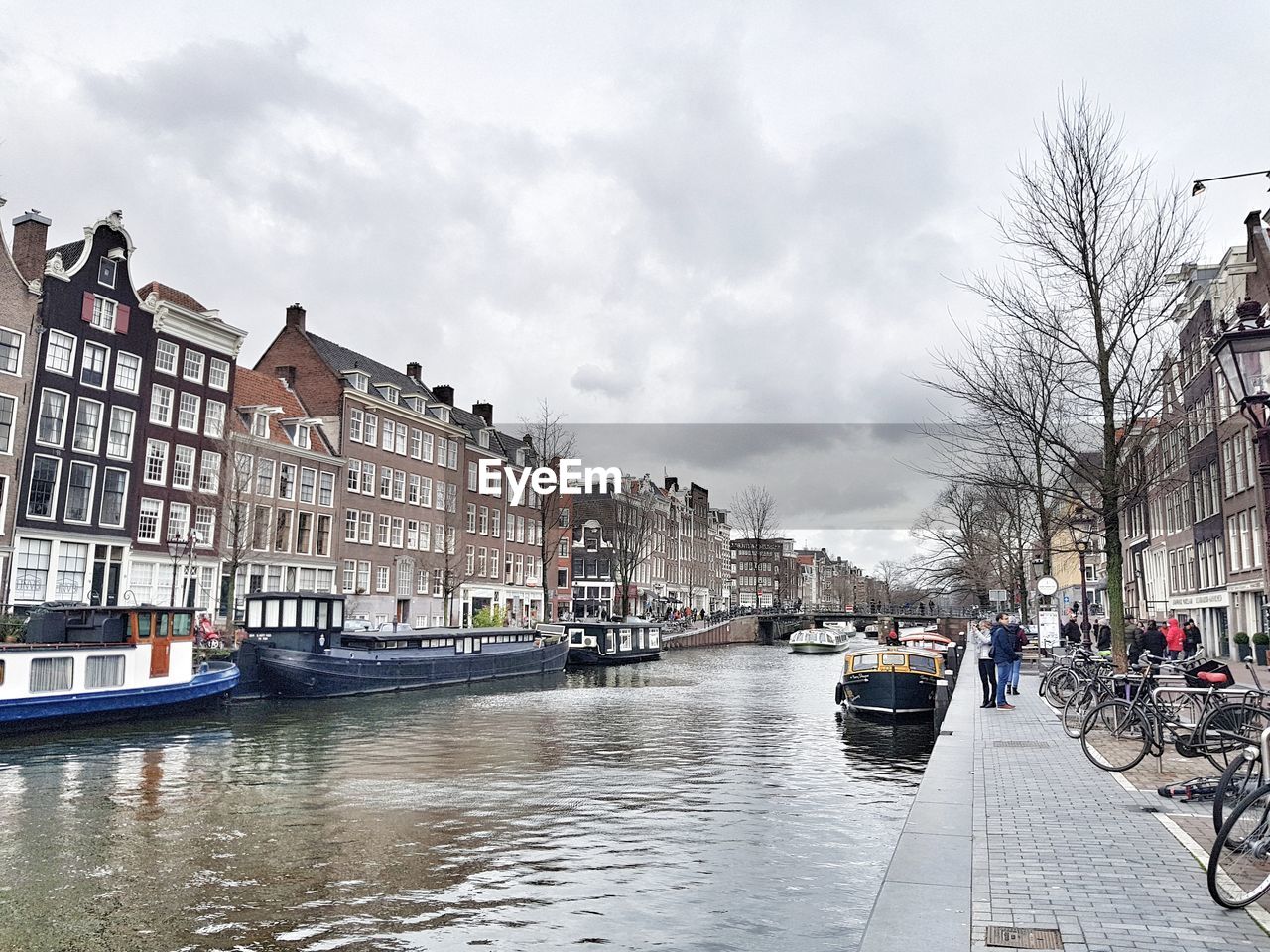 CANAL AMIDST BUILDINGS IN CITY