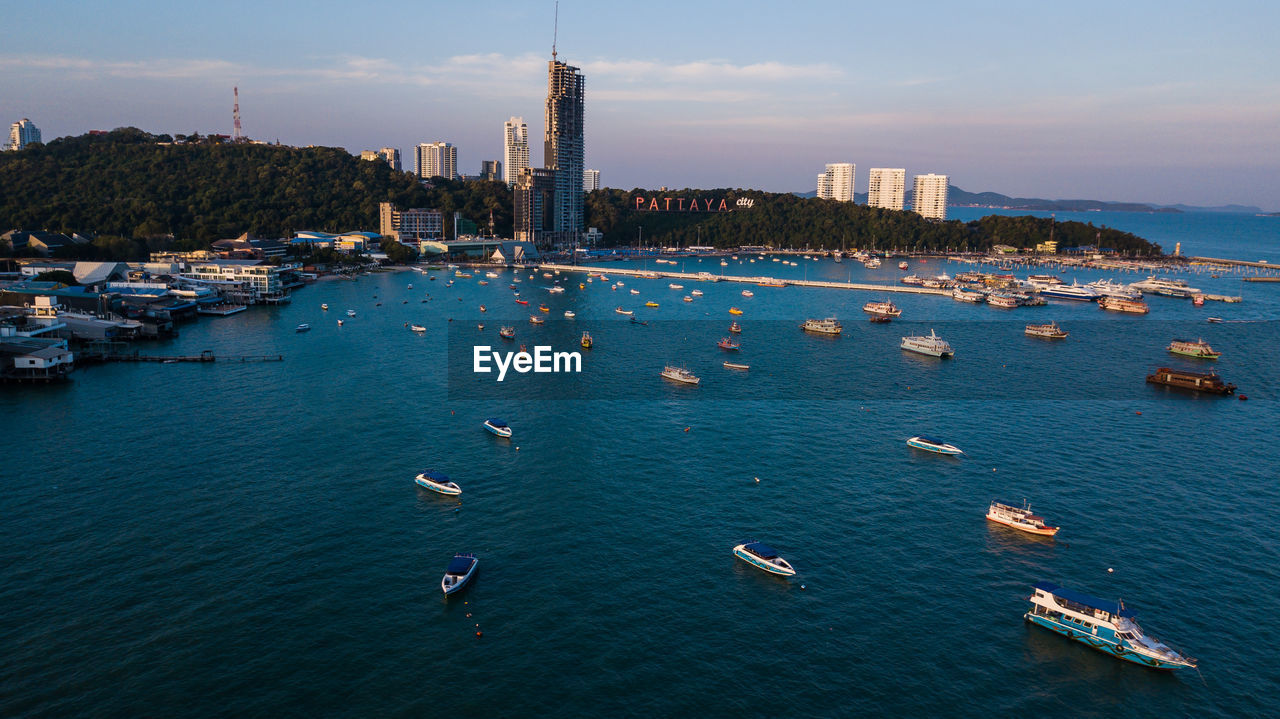 HIGH ANGLE VIEW OF CITY BUILDINGS AT WATERFRONT