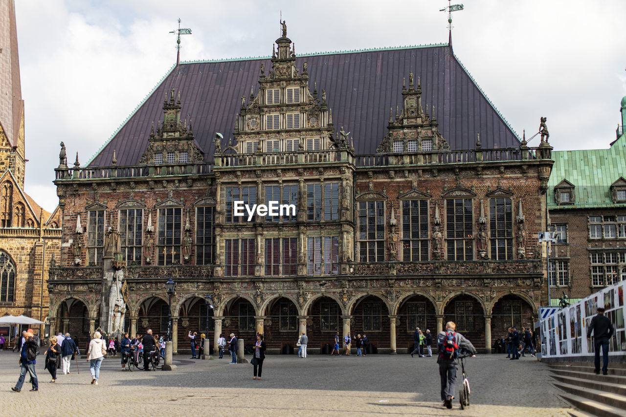 Group of people in front of historical building