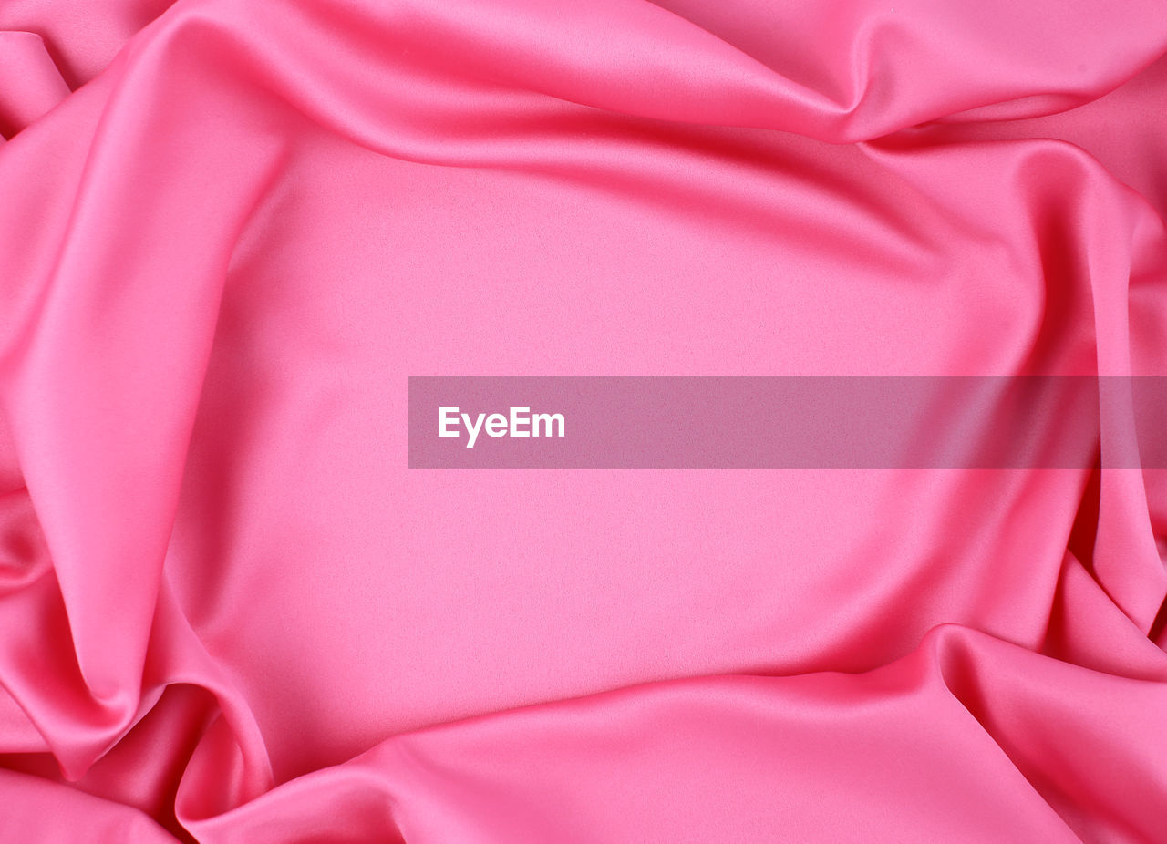 Full frame shot of pink satin sheet