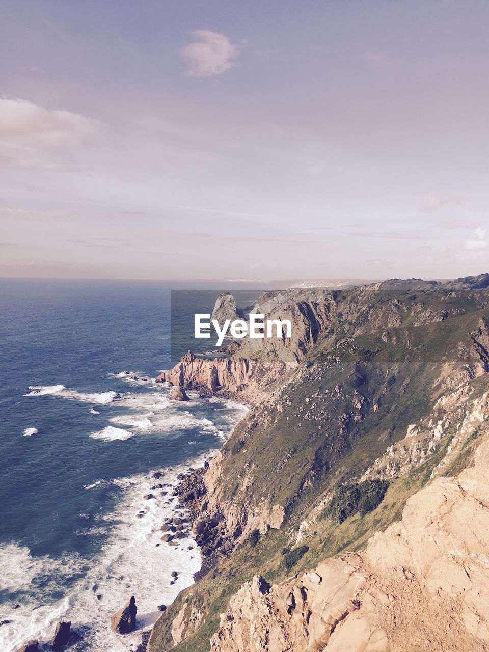 SCENIC VIEW OF SEA AND ROCKS AGAINST SKY