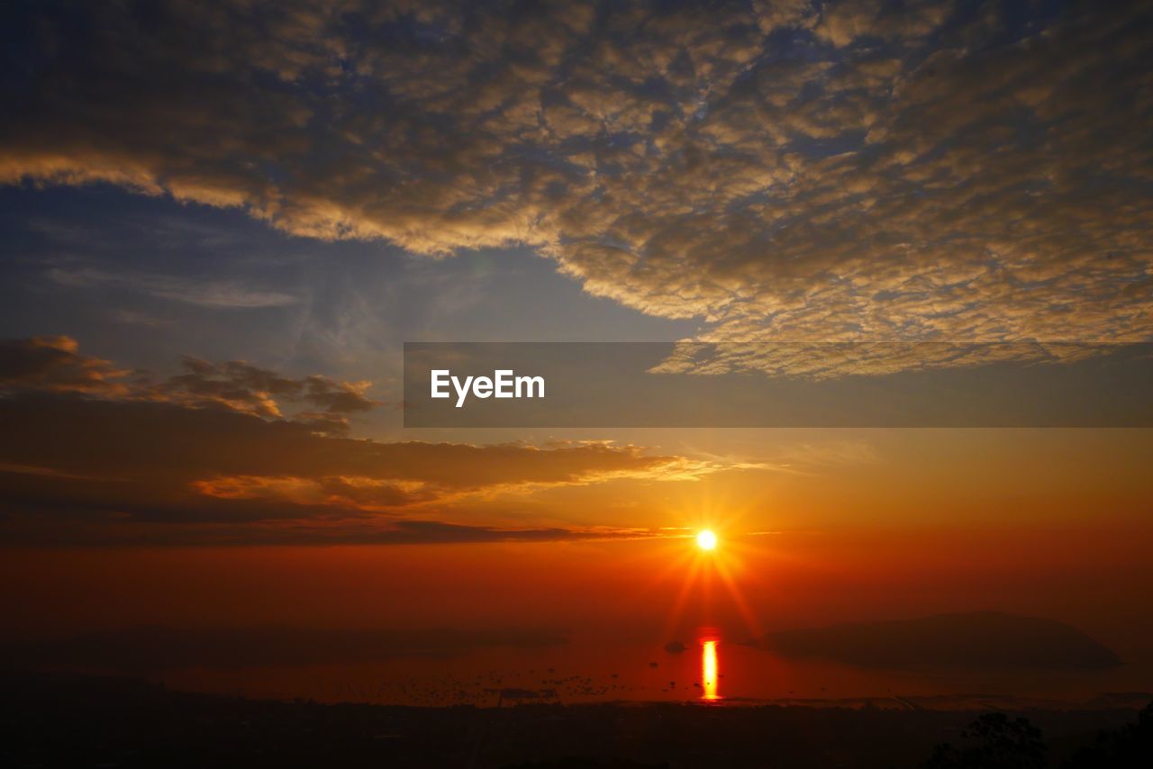 Scenic view of dramatic sky during sunset