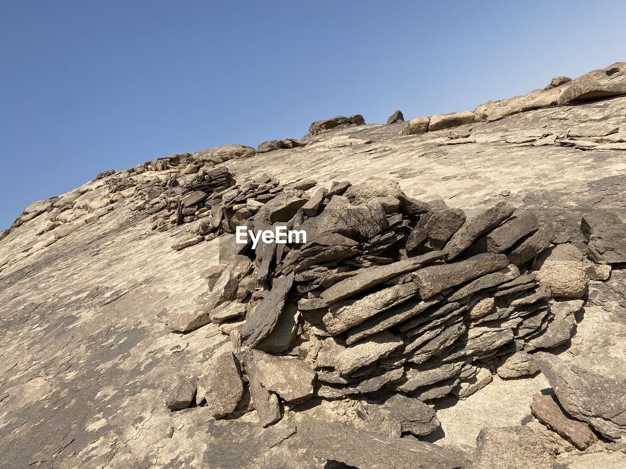 LOW ANGLE VIEW OF ROCK FORMATIONS ON LAND AGAINST SKY