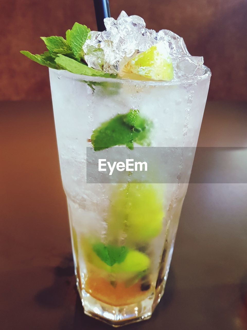CLOSE-UP OF DRINK ON ICE