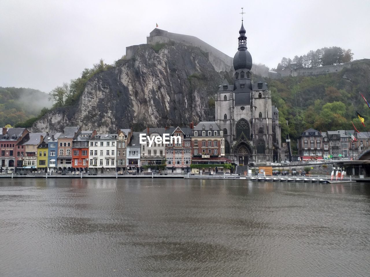 VIEW OF BUILDINGS BY RIVER