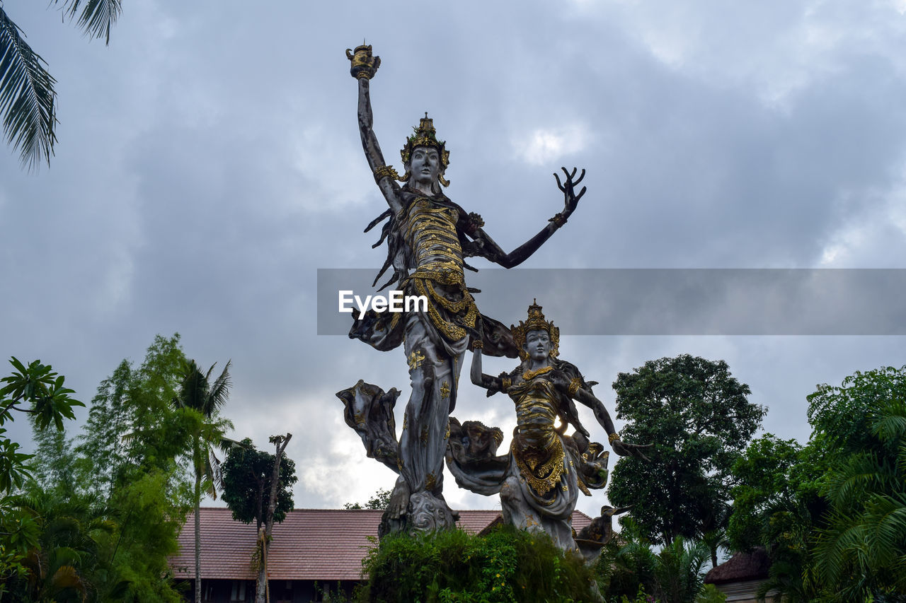 Low angle view of statue against sky
