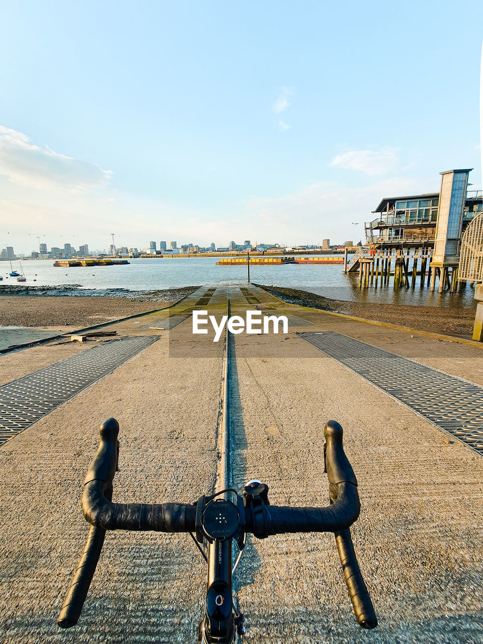 Rider view of bicycle on road looking into the river thames