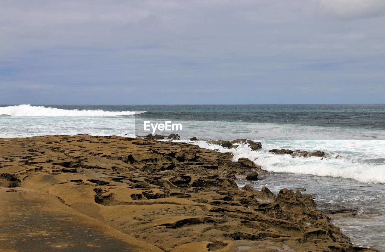 SCENIC VIEW OF BEACH AND SEA