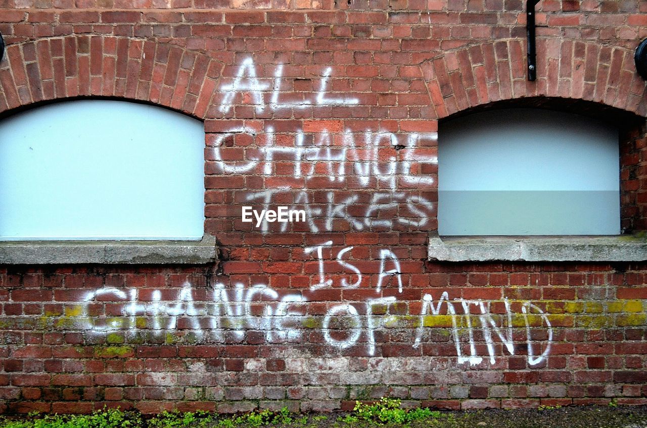 Text on brick wall