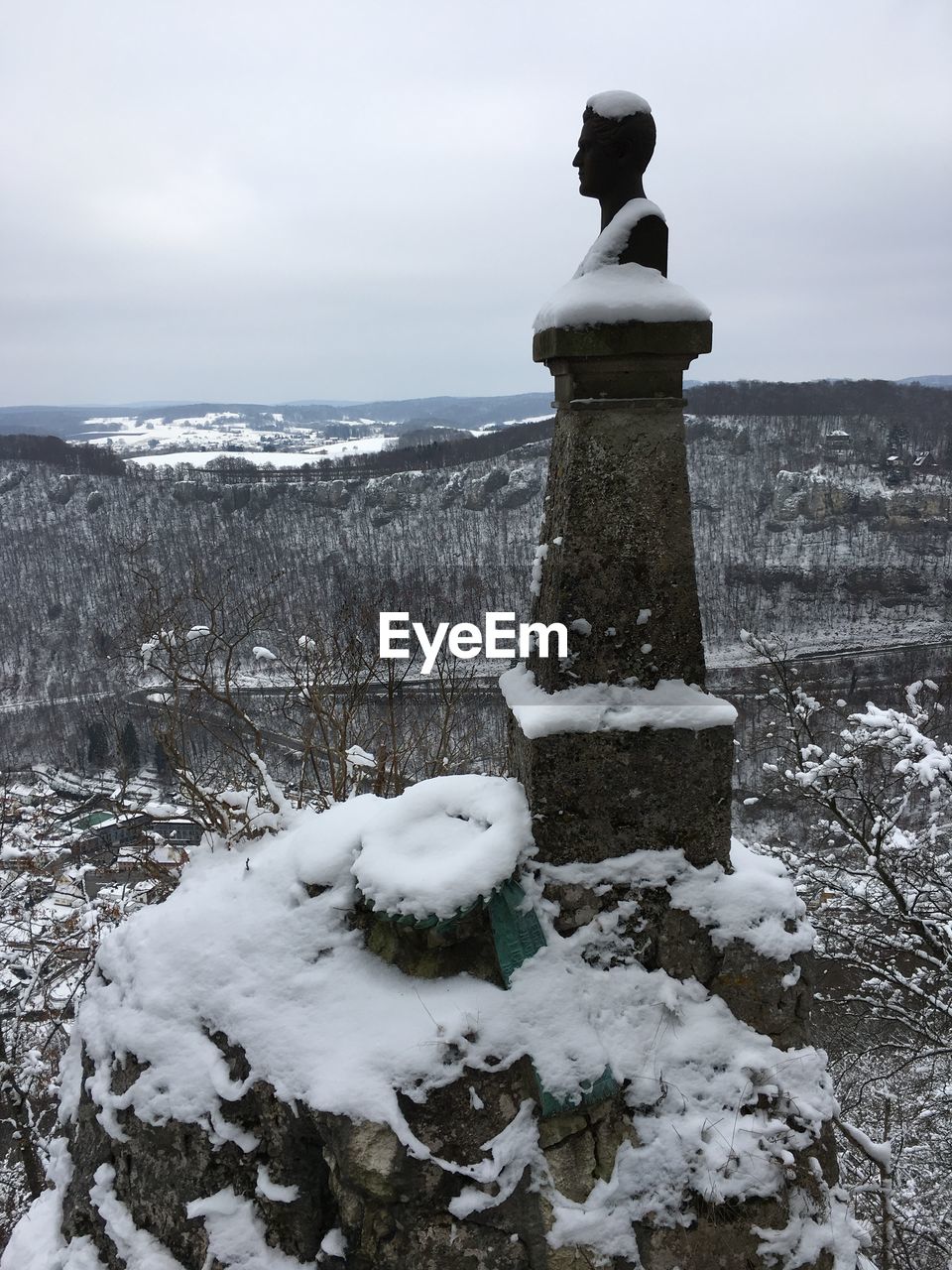 STATUE AGAINST SKY DURING WINTER