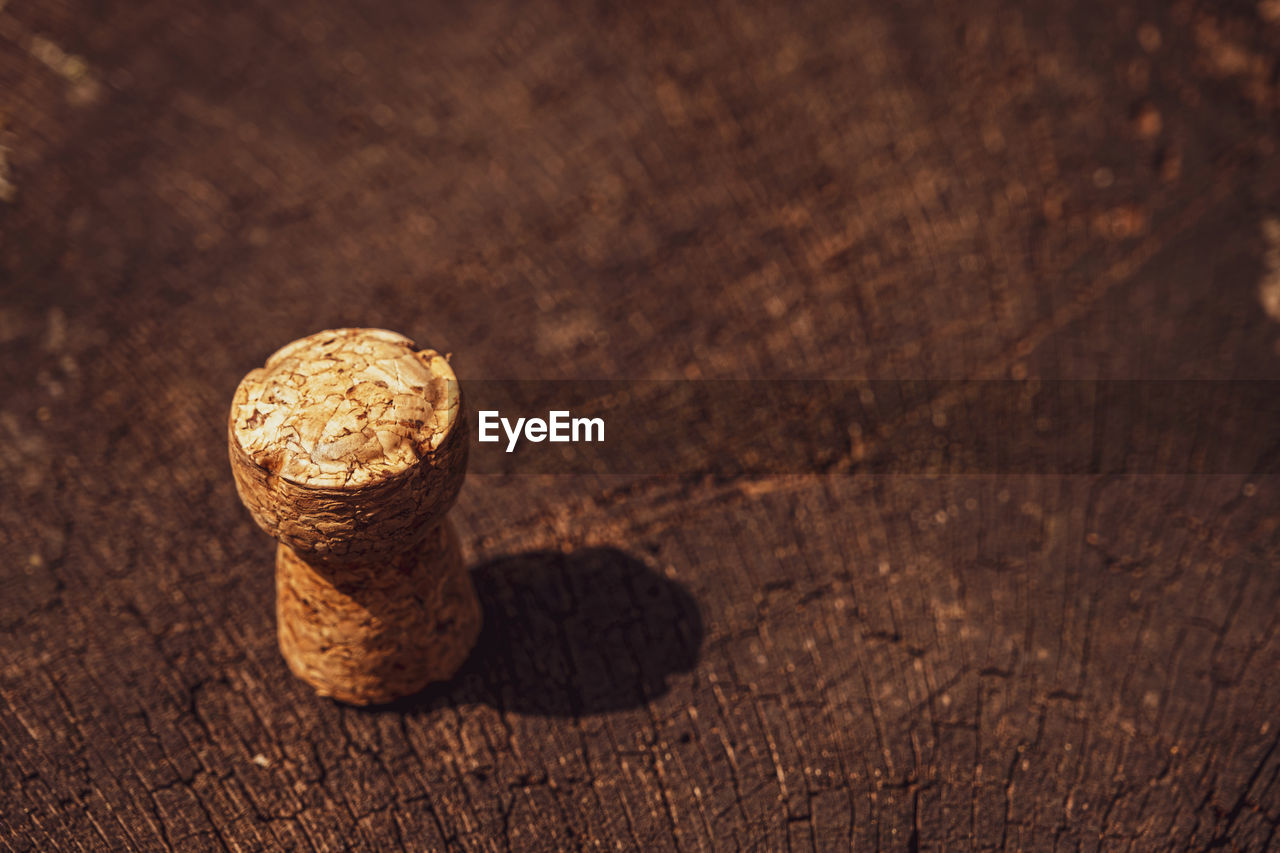 close-up, macro photography, wood, food and drink, brown, cork - stopper, no people, coin, wine cork, soil, drink, money, food, indoors, finance, table, wealth, refreshment