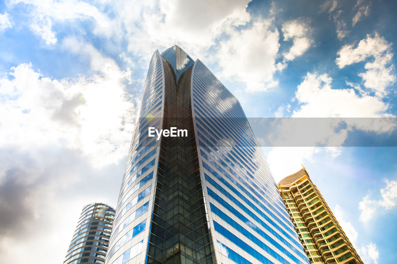 Low angle view of modern buildings against sky