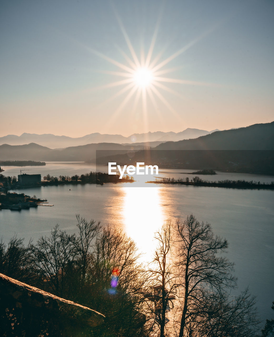 Scenic view of lake against sky during sunset