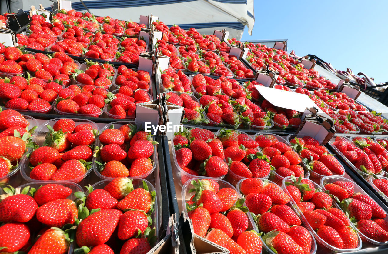 STRAWBERRIES IN MARKET STALL