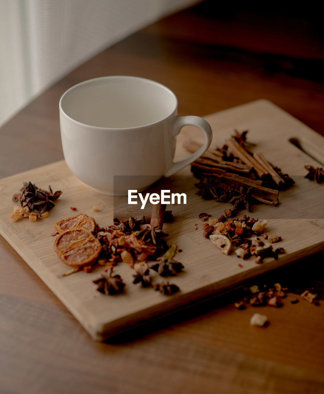 CLOSE-UP OF CUP AND COFFEE WITH TEA ON TABLE