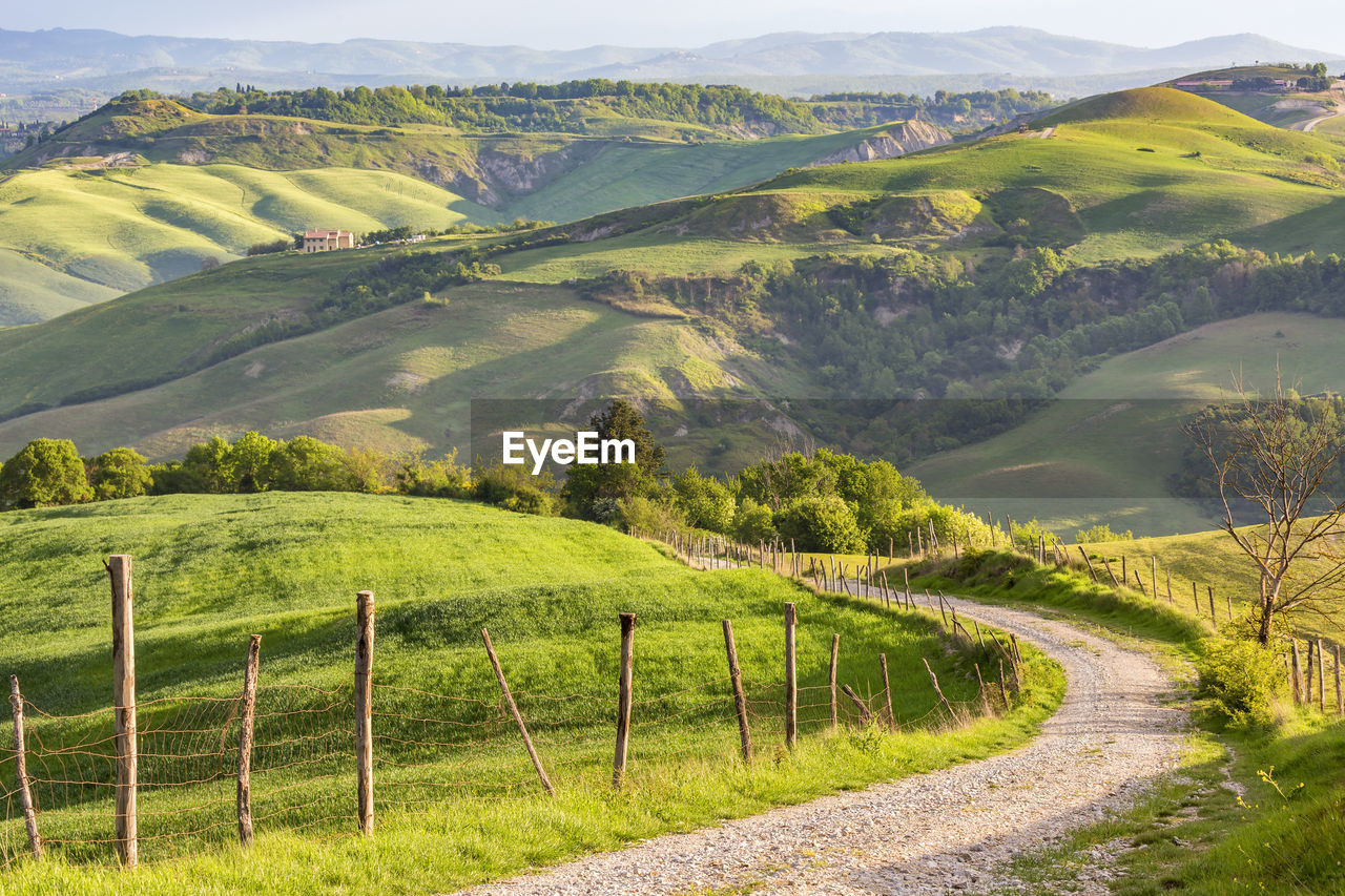 Scenic view of country road against sky