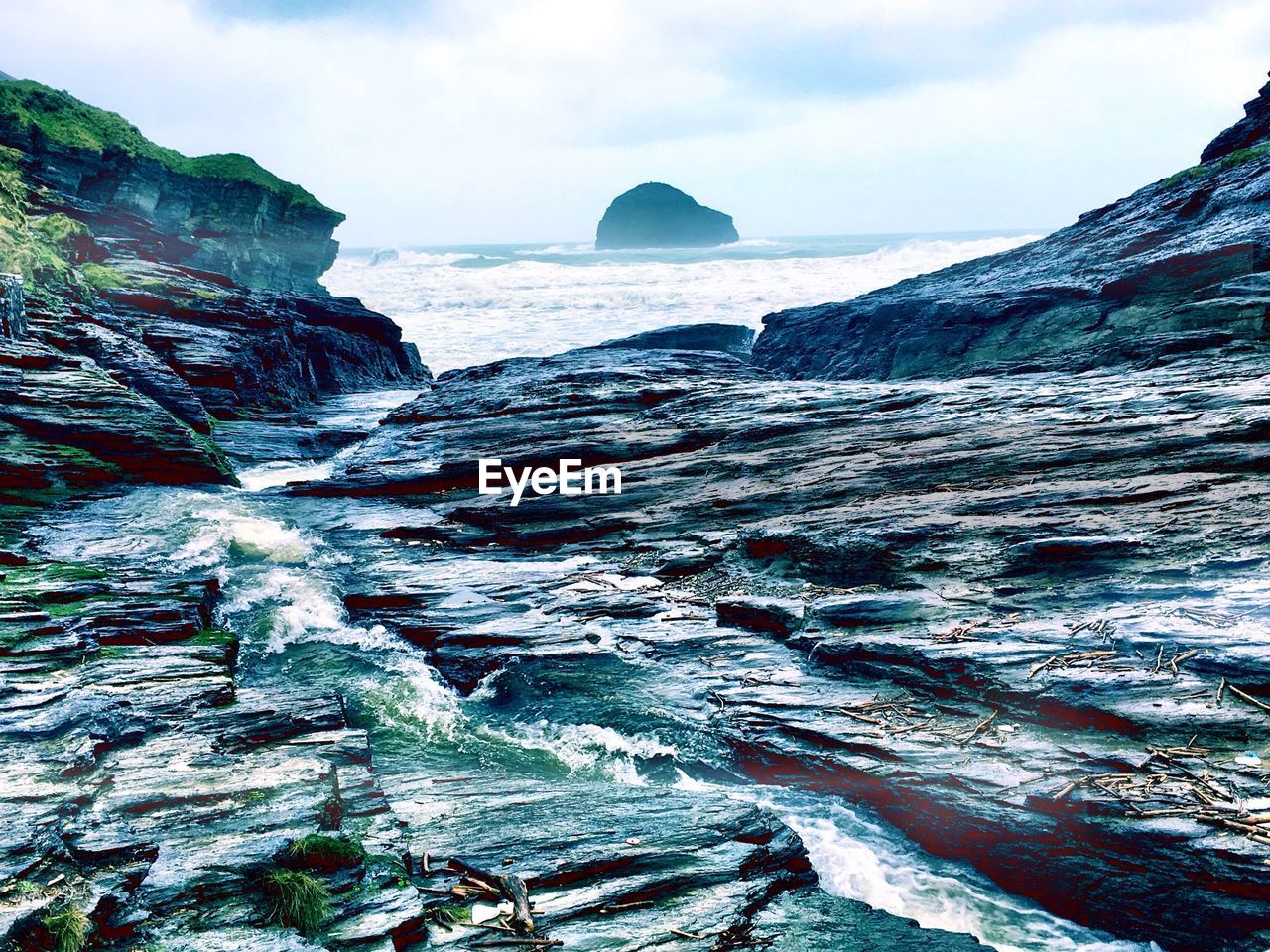 Rock formations against sea