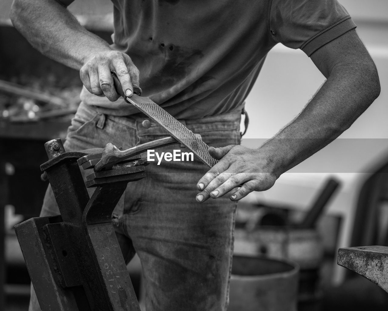 Midsection of man working outdoors