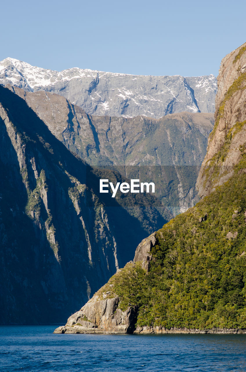 SCENIC VIEW OF ROCKY MOUNTAINS AND SEA