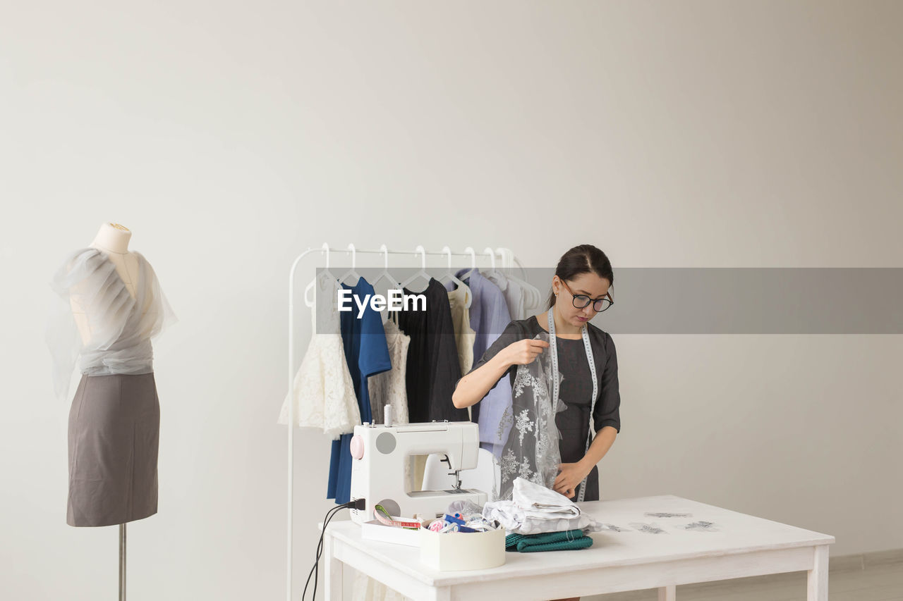 Woman standing on table