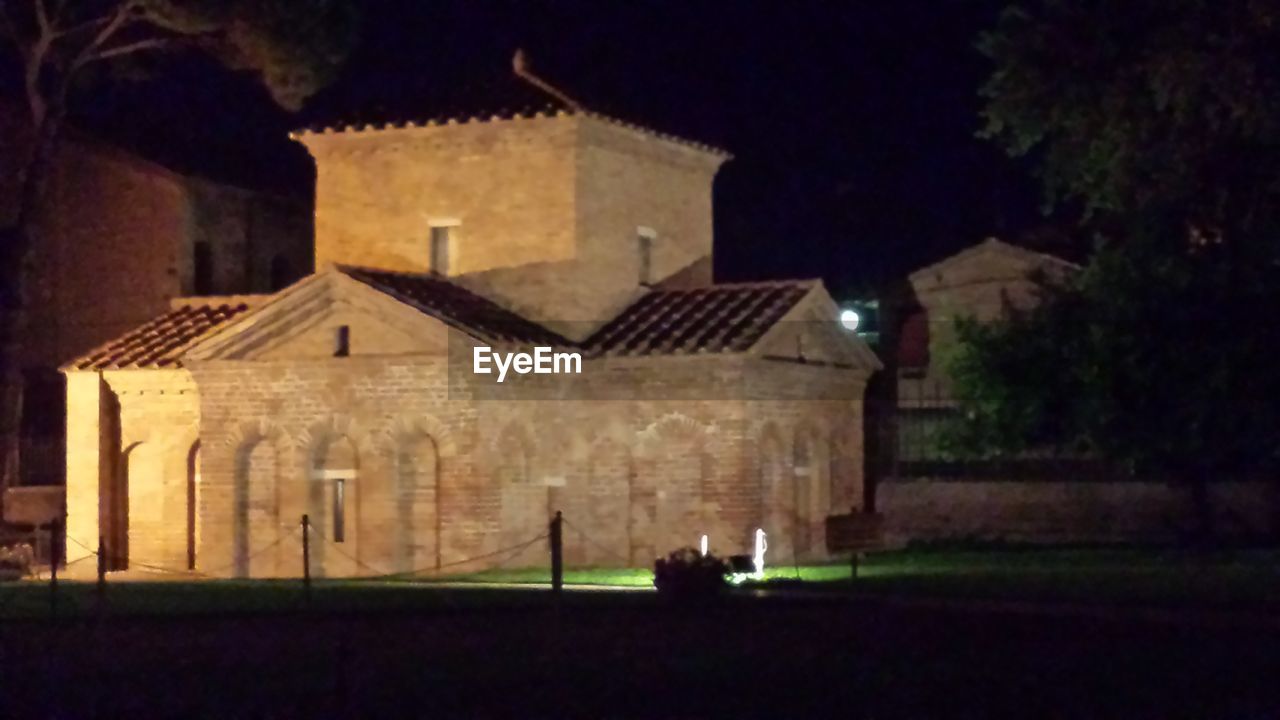 VIEW OF ILLUMINATED BUILDINGS AT NIGHT