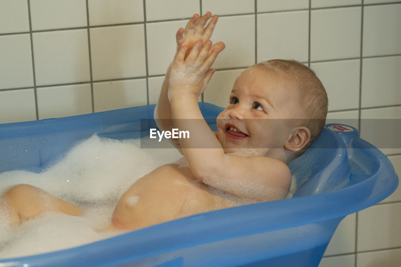 Portrait of boy in bathtub