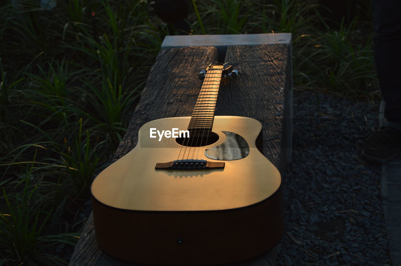 High angle view of guitar on grass