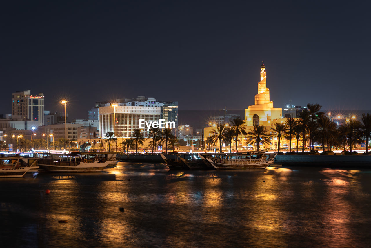 Illuminated buildings in city at night