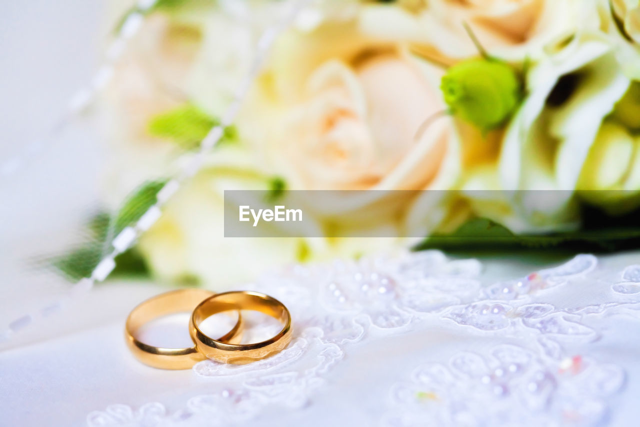 Close-up of wedding rings on table