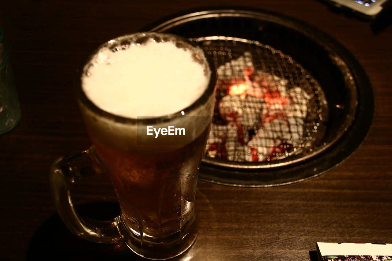 CLOSE-UP OF COFFEE CUP ON TABLE