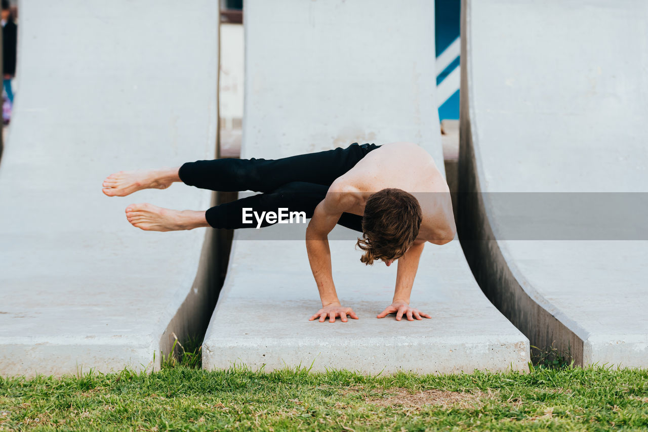 Full length of man exercising at park