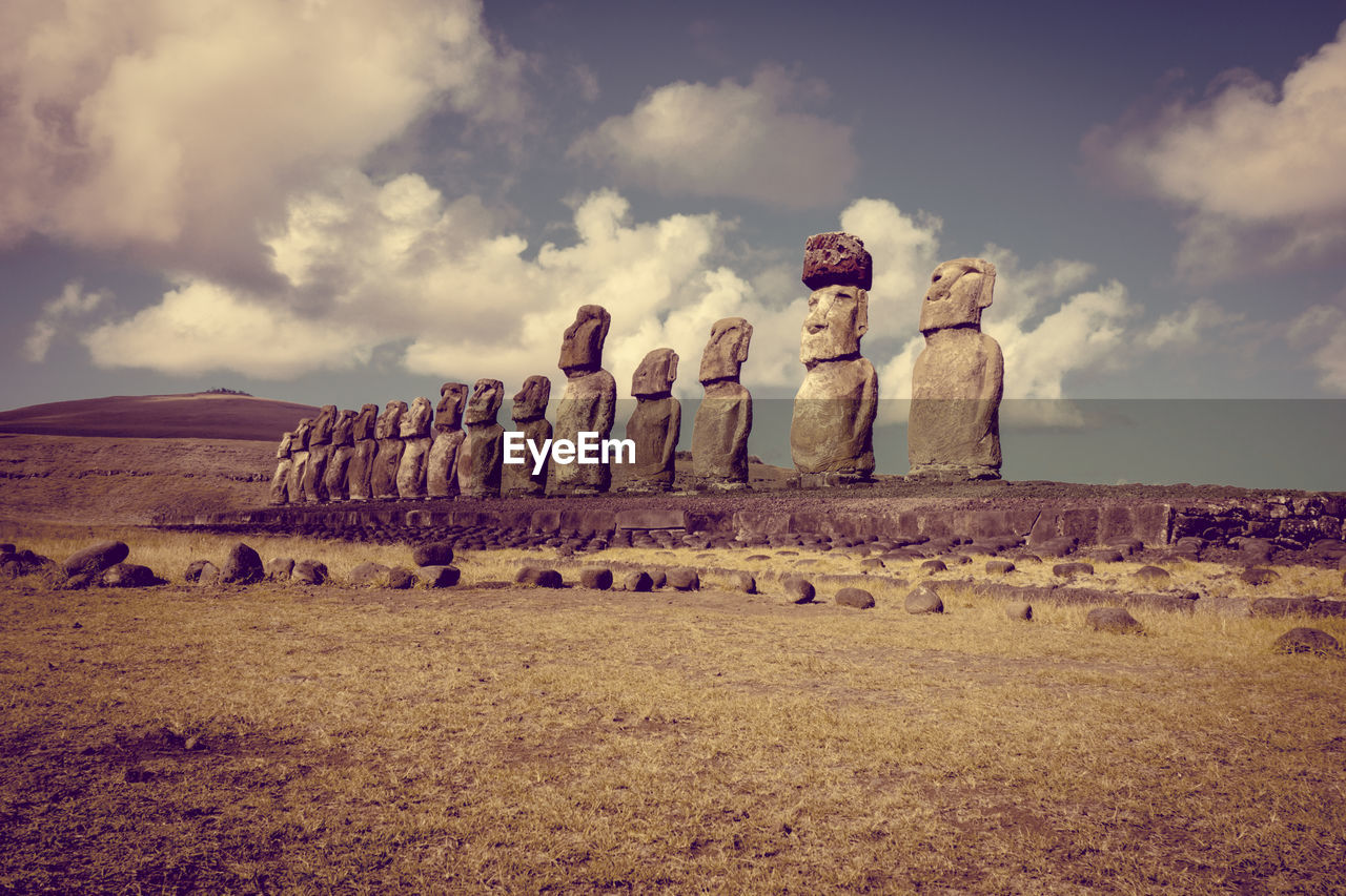 STONE STRUCTURE ON FIELD AGAINST SKY