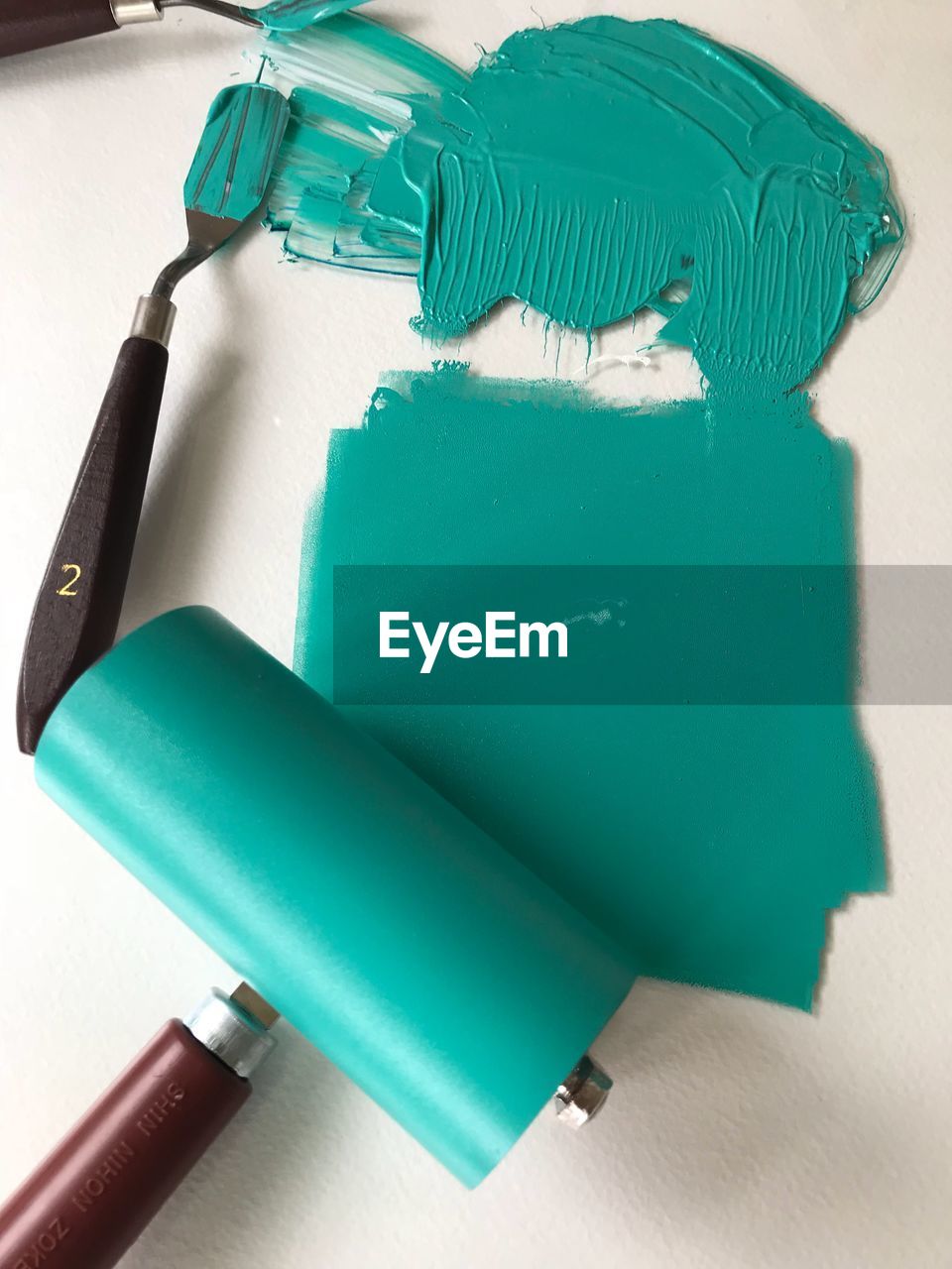 Teal paint and roller art 