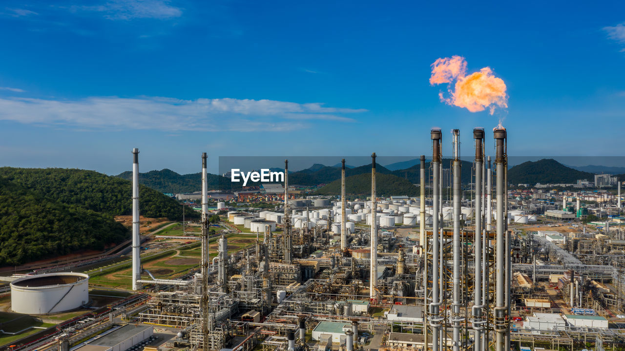 Aerial view oil and gas refinery petrochemical plant industrial with oil and gas storage tank.