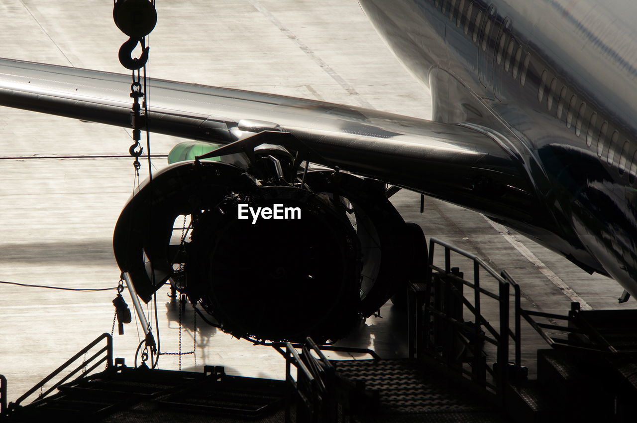 Cropped image of airplane at runway