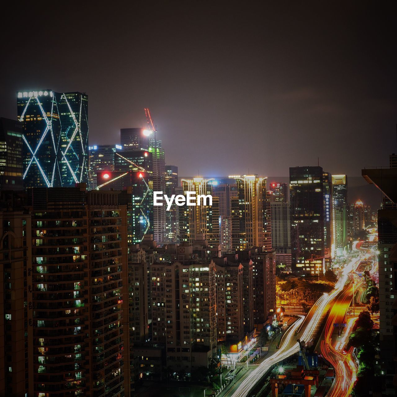 High angle view of illuminated buildings in city at night