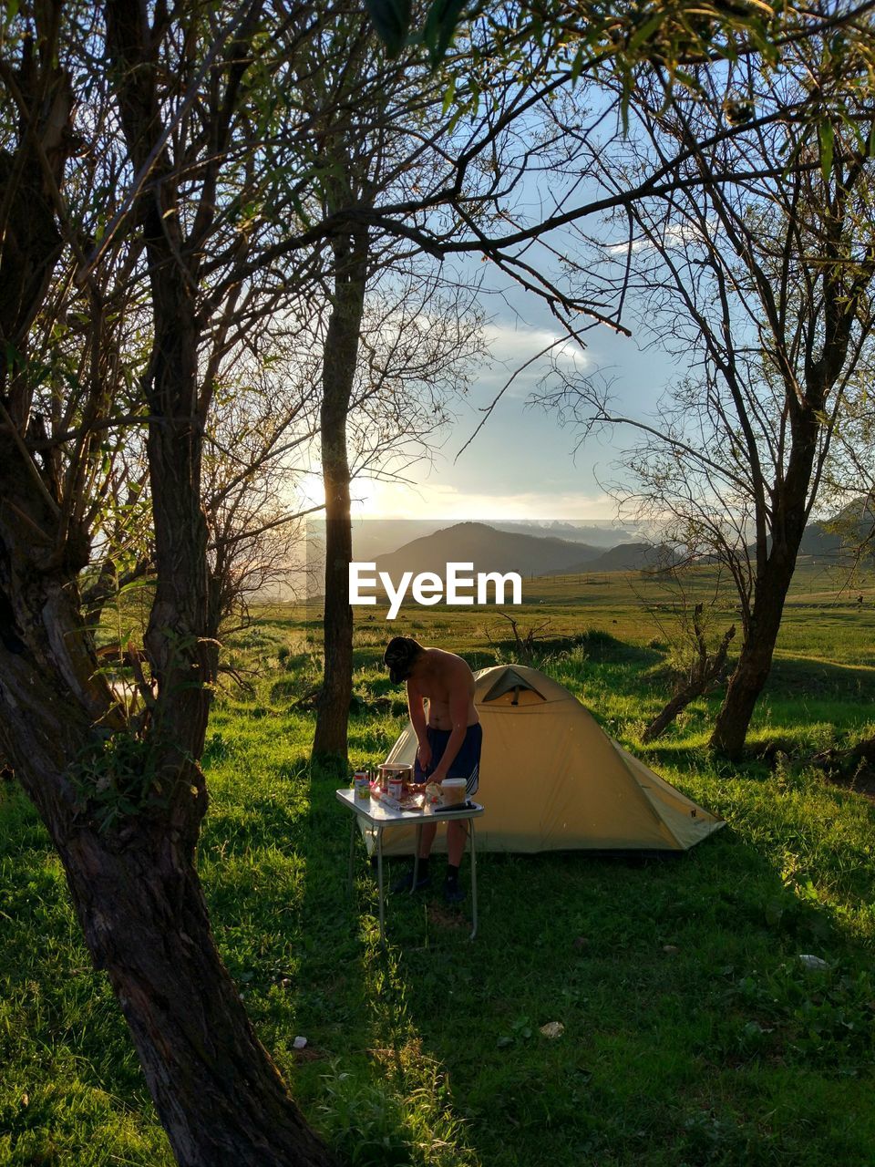 WOMAN LYING DOWN ON FIELD