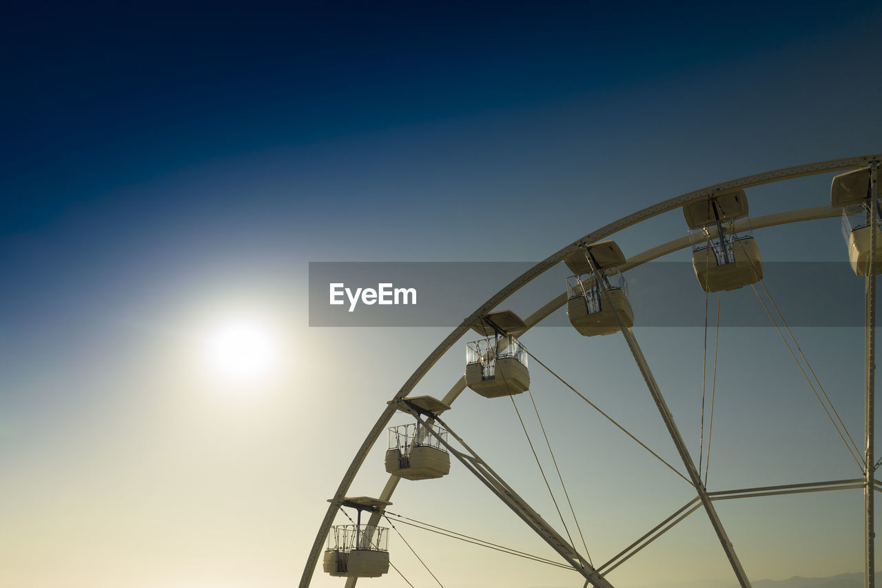 Aerial shot with a drone of a detail of a ferris wheel