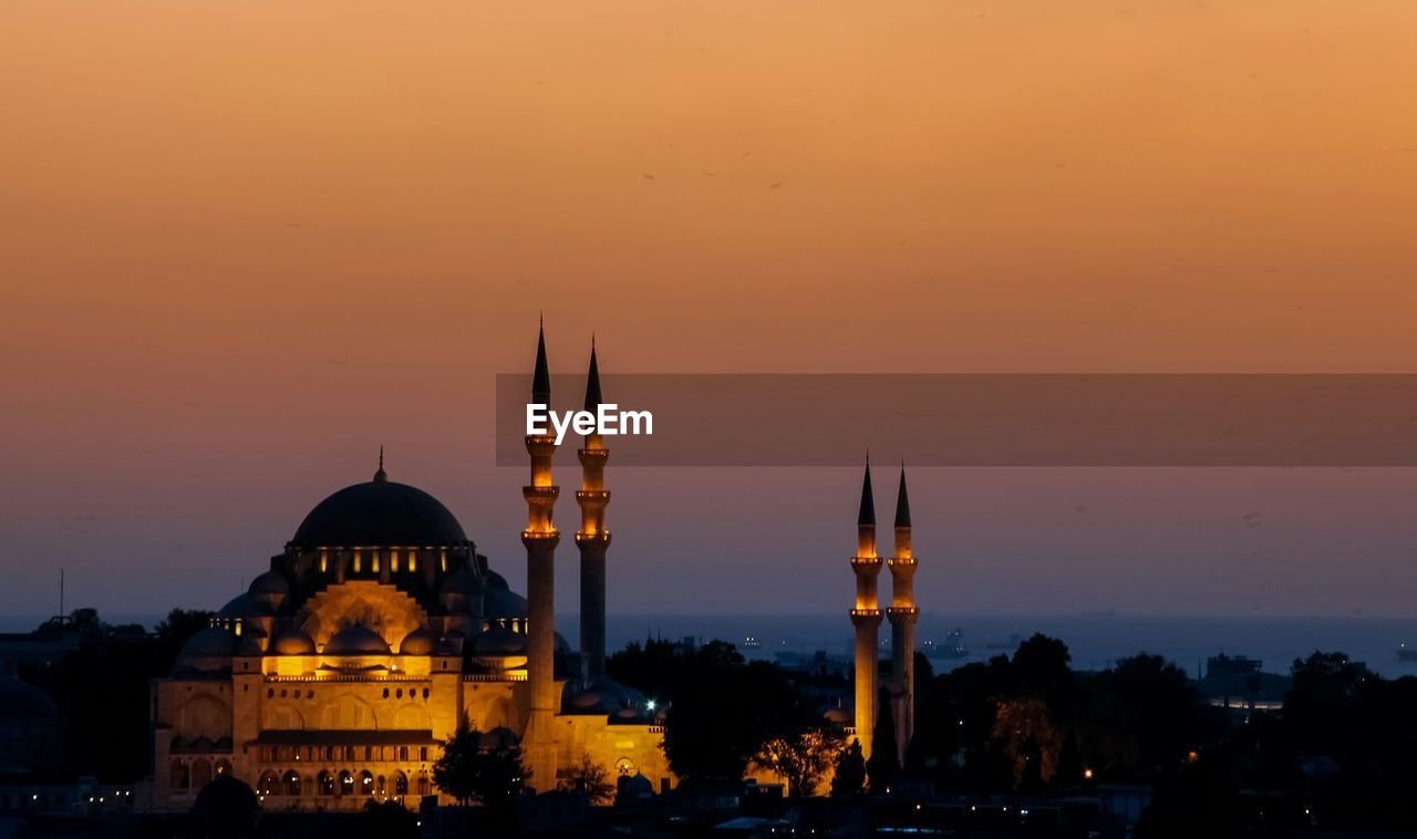 Sultan ahmed mosque against sky in city at dusk