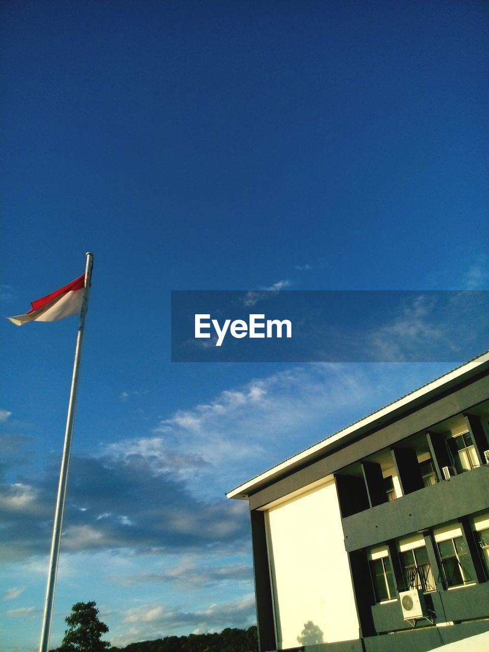 LOW ANGLE VIEW OF FLAG FLAGS AGAINST SKY