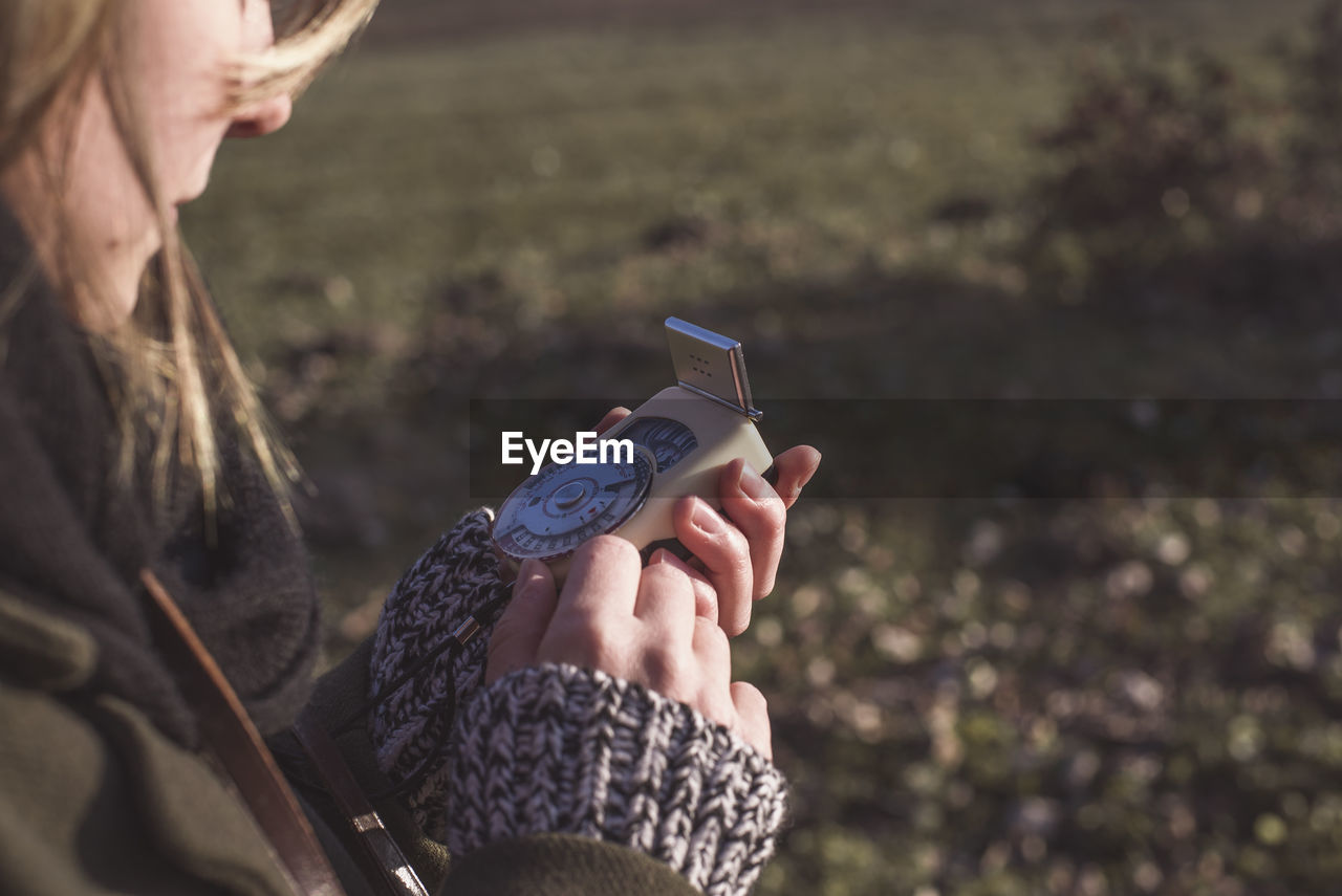 Close-up of woman holding equipment