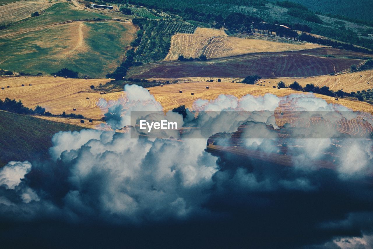 High angle view of landscape against sky, surrealism