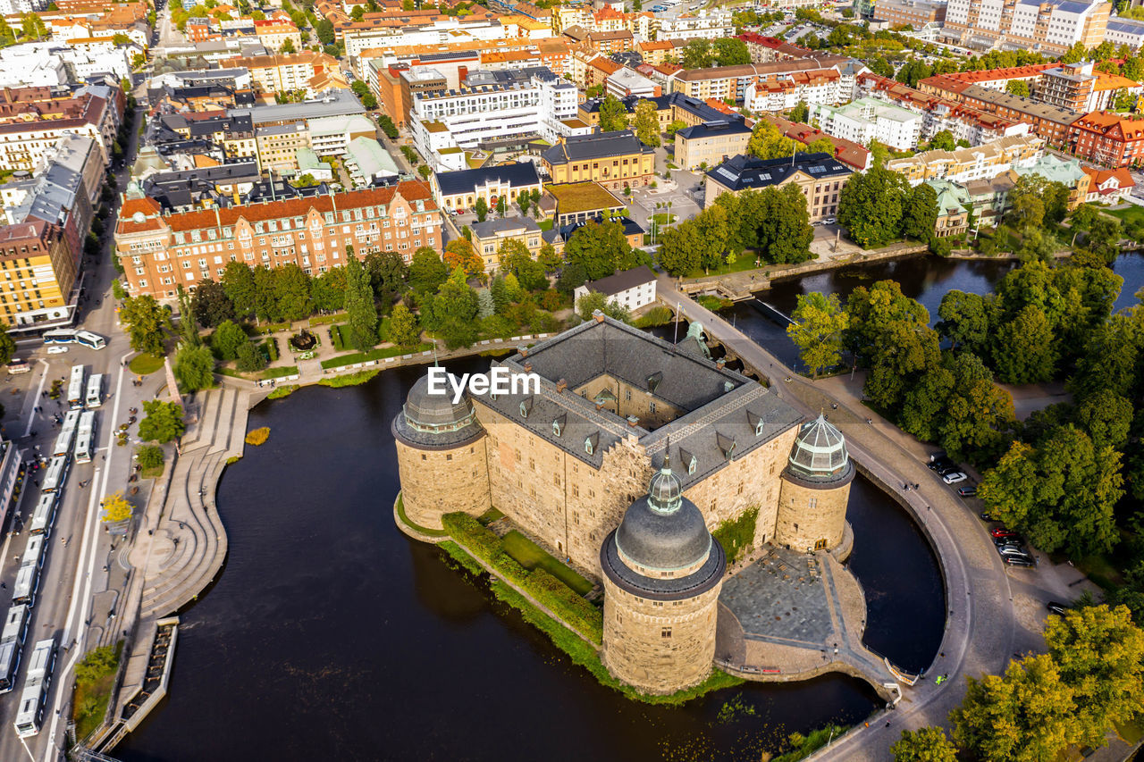 High angle view of river amidst buildings in city