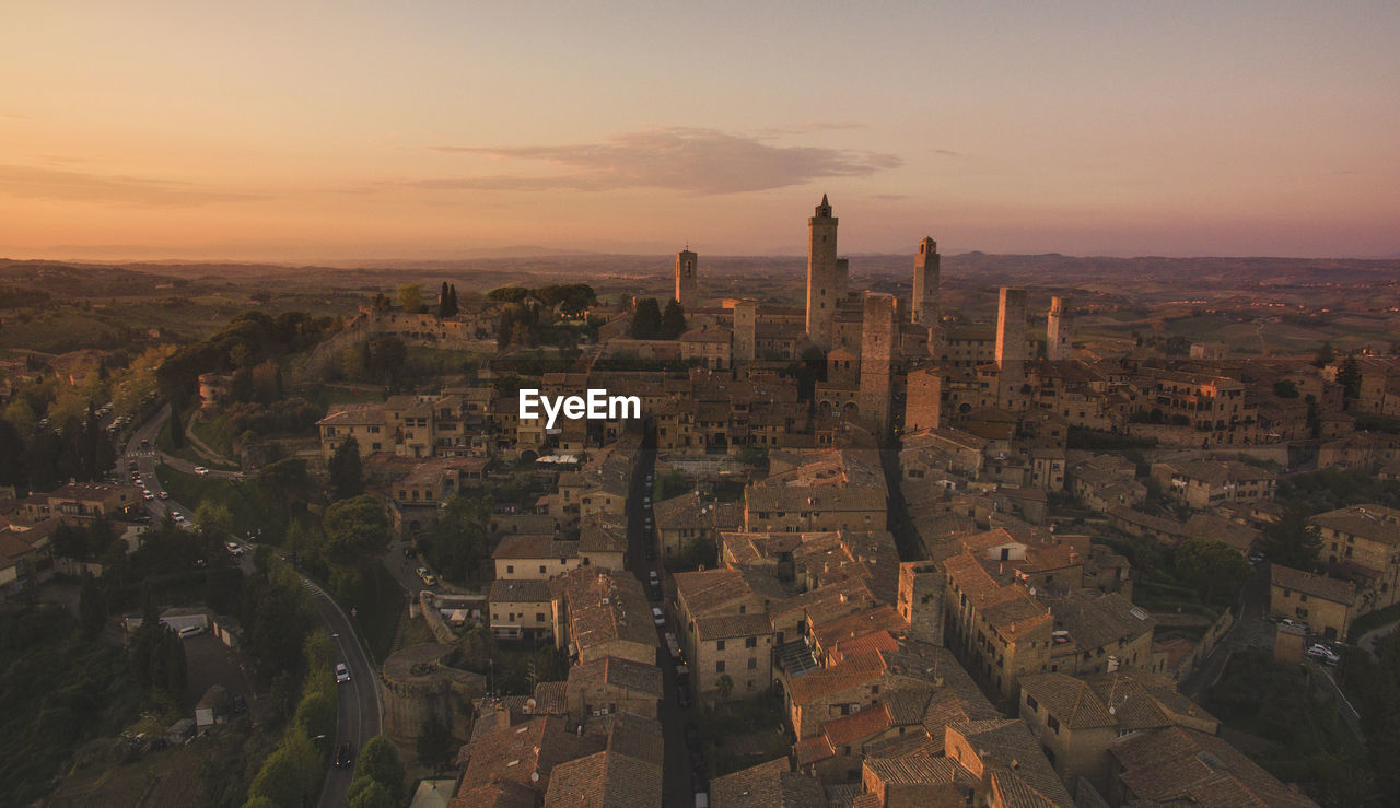 High angle view of city buildings during sunset