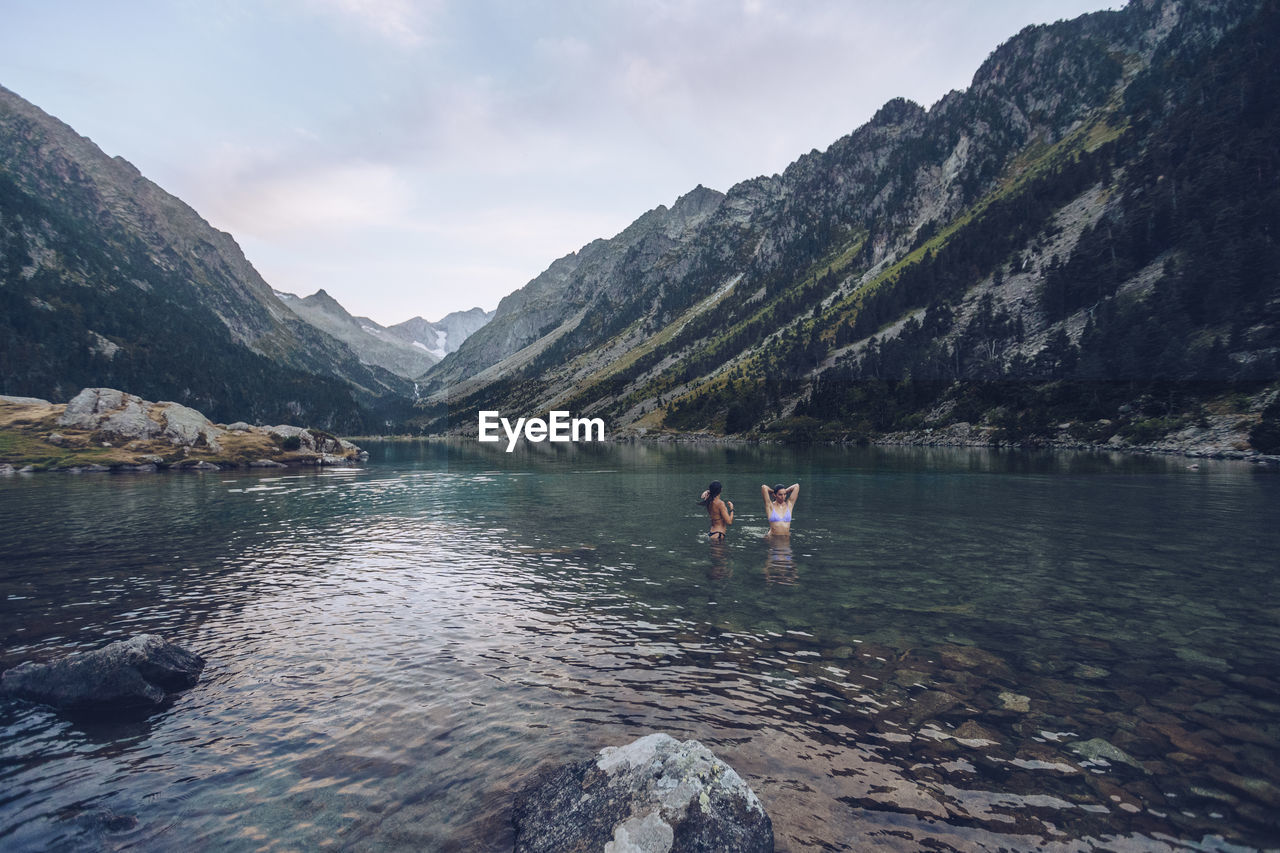 Young women taking bath in lake of gaube