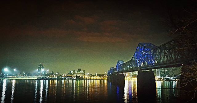 VIEW OF ILLUMINATED BUILDINGS AT NIGHT