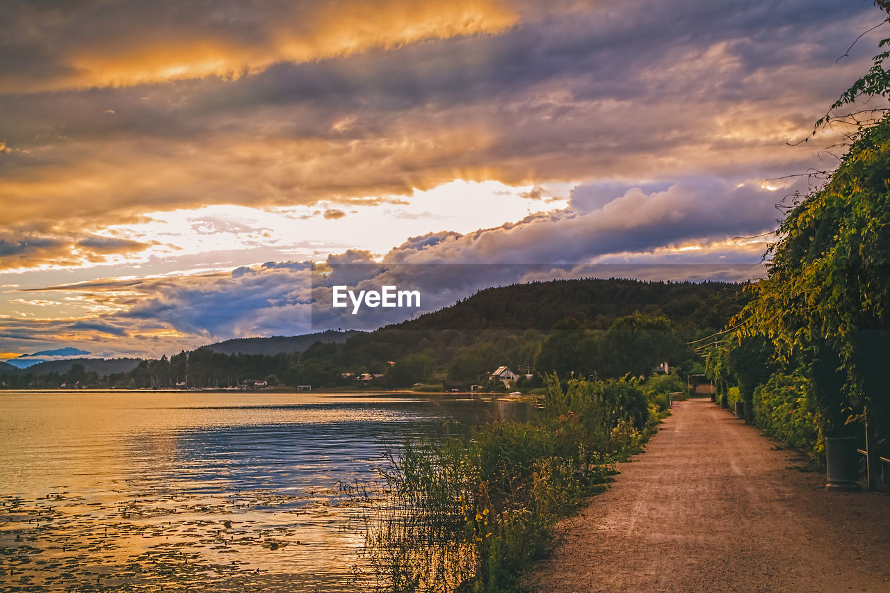 SCENIC VIEW OF LAKE BY TREES AGAINST SKY